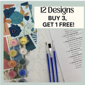 May include: A paint-by-numbers kit with a floral design, paint pots, and brushes. The kit includes a canvas with a floral design, numbered paint pots, and three blue-handled paintbrushes. The text "12 Designs BUY 3, GET 1 FREE!" is also visible.