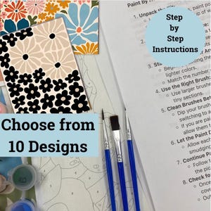 May include: A paint by numbers kit with 10 different designs to choose from. The kit includes three paintbrushes, paint pots, and a canvas with numbered sections. The instructions are printed on a white sheet of paper and include a step-by-step guide for completing the project.