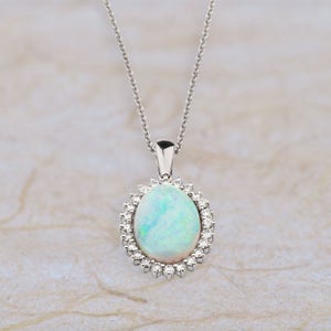 14k White Gold Opal Pendant With a 16 x 12MM  Oval Australian Opal 1.00ctw of G Color SI2 Clarity Diamonds