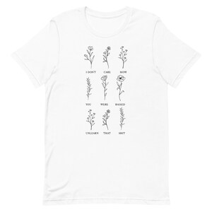 Floral Unlearn That Shit Unisex Graphic Tee T-shirt Gifts for Activists, Feminists Sizes XS, S, M, L, XL, 2XL, 3XL, 4XL, 5XL White