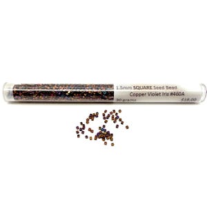 May include: A clear tube filled with small, square seed beads in copper and violet tones. The tube is labeled "1.5mm SQUARE Seed Bead Copper Violet Iris #460A" and contains 30 grams of beads. A small pile of beads is scattered below.