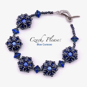 May include: A bracelet made with dark gray and blue Czech glass beads. The beads are arranged in a pattern of snowflakes. The bracelet has a silver clasp. The text "Czech, Please! Blue Curacao" is written on a white background.