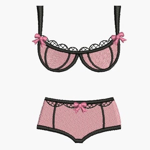 Puede incluir: Conjunto de lencería rosa y negro con encaje y lazos.