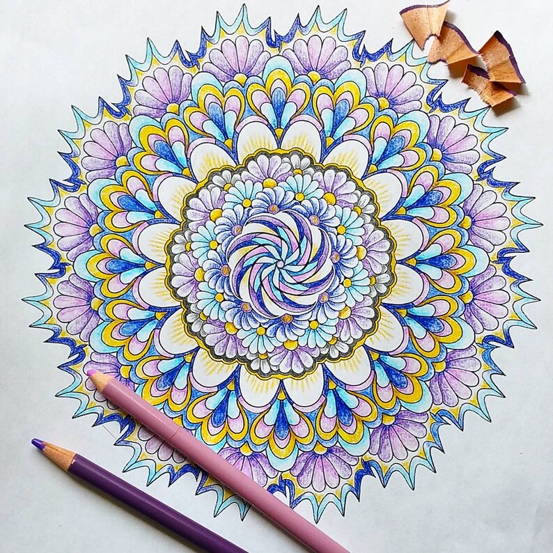 May include: A colorful mandala design with intricate patterns in shades of blue, purple, yellow, and white. The mandala is surrounded by a white background.