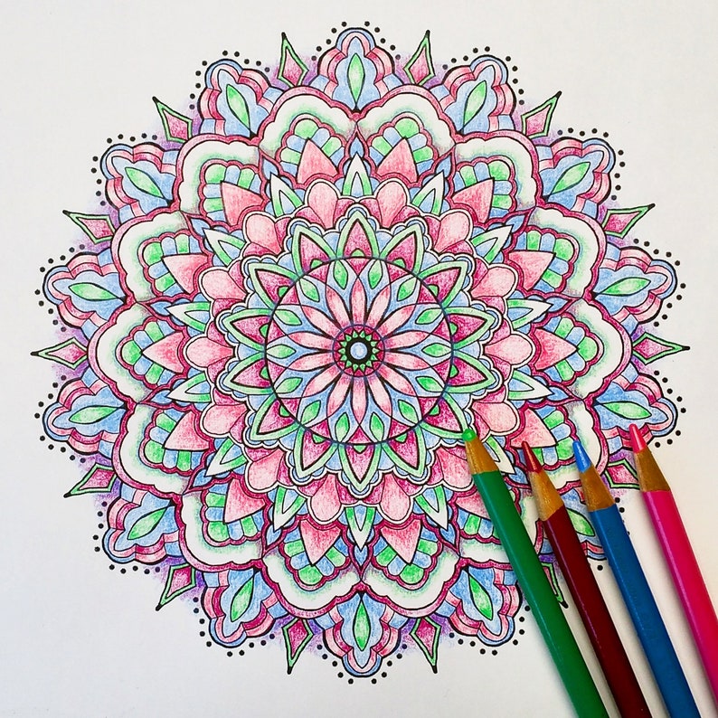 May include: A detailed mandala design with intricate patterns in shades of pink, blue, and green. The mandala is surrounded by a border of small dots.