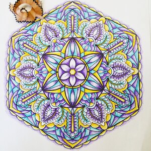 May include: A colorful mandala design with intricate patterns in shades of purple, yellow, and blue. The mandala is drawn in pencil and colored with colored pencils.
