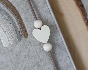 Zusatzoption Herzperle an Gummikordel - für HÜLLE aus MEINEM SHOP (Farbe helles Holz wie Bild)