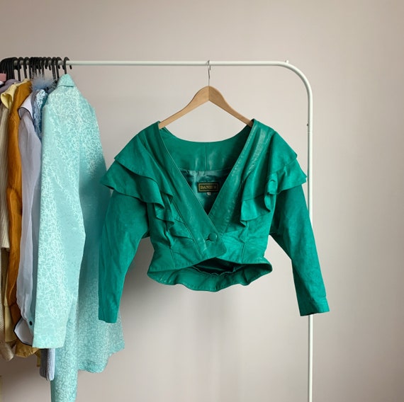 80s glam cropped suede jacket · exaggerated should