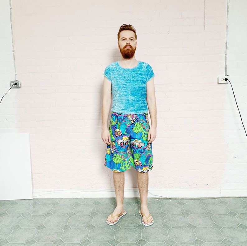 high waist graphic 80s print bermuda shorts \u00b7 neon beach gear \u00b7 vintage cartoon print trunks \u00b7 medium