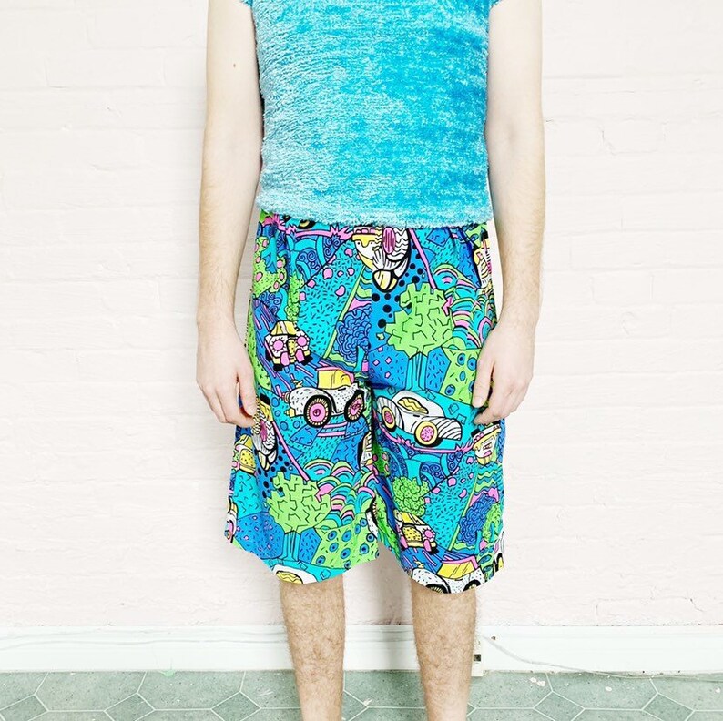 high waist graphic 80s print bermuda shorts \u00b7 neon beach gear \u00b7 vintage cartoon print trunks \u00b7 medium