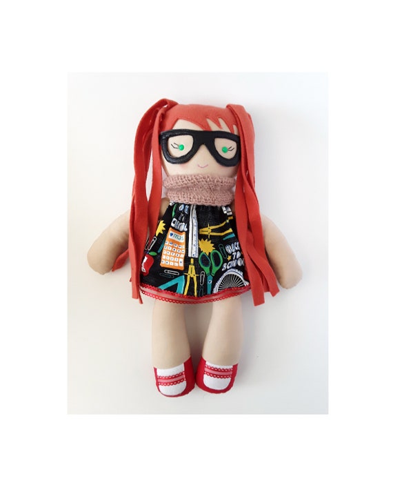 soft doll with glasses