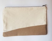 tan canvas metal zipper clutch with wool accent and tribal print lining.