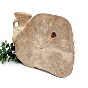 Reclaimed birch tree round slab with no bark. 7-9inch (18-23cm) diameter. The tree slice is irregular organic shape, level and sanded to smooth. Perfect for rustic centerpiece.