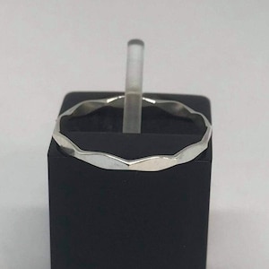 Sterling silver hammered design stackable ring. Faceted ring.