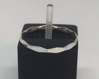 Sterling silver hammered design stackable ring. Faceted ring.