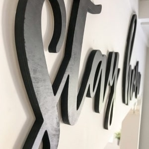 closeup of let's stay home letters
