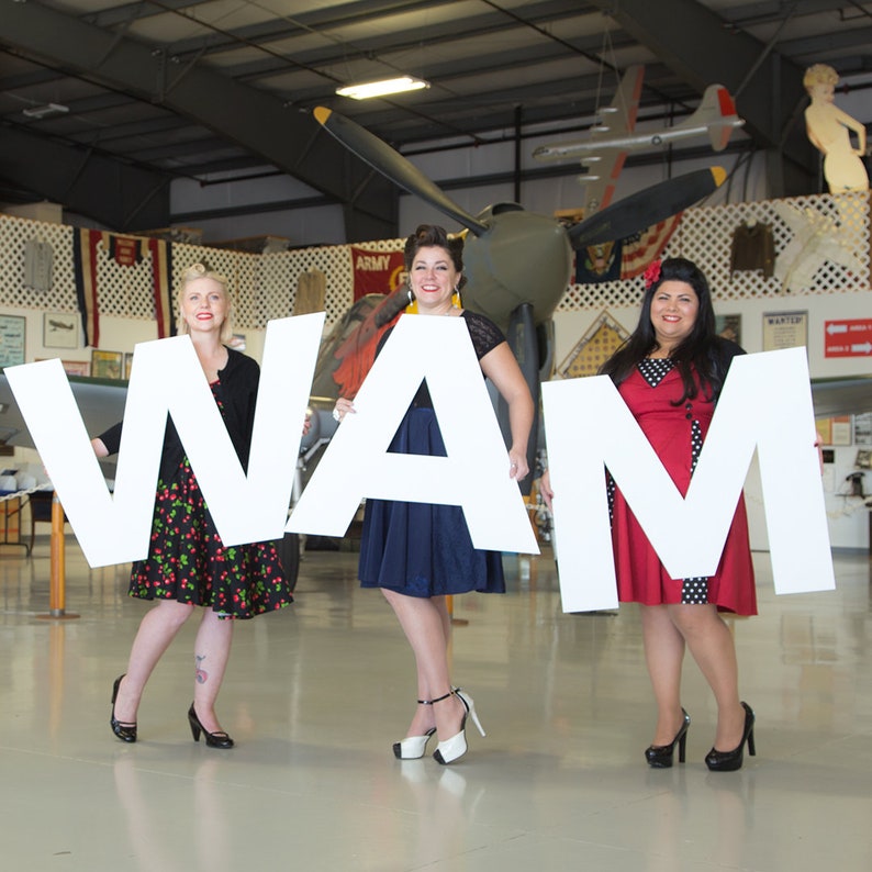 giant plastic letters spelling wam