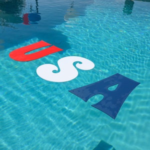 Thin plastic letters corrugated plastic coroplast floating in pool