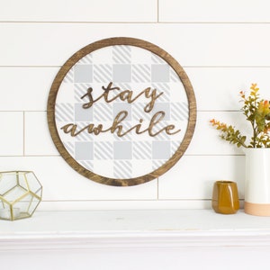 DIY craft with unfinished wooden ring shape for making a wreath, circle frame, or other craft projects