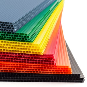 side view of colored plastic letters blue green yellow red orange black