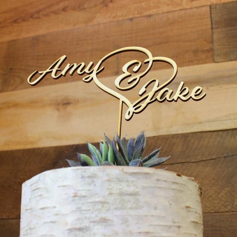 first name and heart wood cake topper example shows Amy & Jake