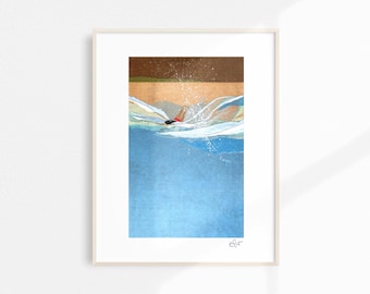 May include: A framed art print depicts a swimmer diving into blue water. The artwork features a person in a red swimsuit, creating a splash. The top portion shows a brown and gold area, possibly representing a beach or shoreline.