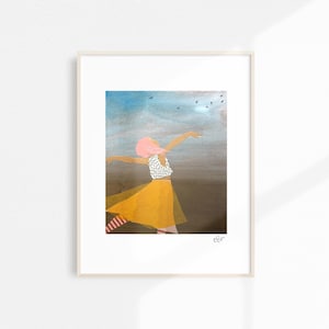 May include: A framed art print featuring a figure with outstretched arms, wearing a yellow skirt and a white top with black polka dots. The background shows a blue sky with birds in flight. The figure has pink hair.