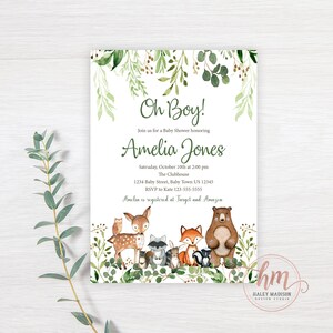 May include: A baby shower invitation with a woodland theme. The invitation features a watercolor illustration of a deer, fox, raccoon, owl, and bear surrounded by green foliage. The text on the invitation reads "Oh Boy!" and "Amelia Jones".