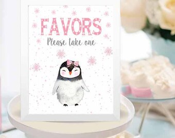 May include: A white sign with a pink penguin and the text "Favors Please take one" on a table with pink and white decorations.