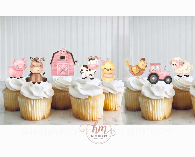 May include: Pink and brown farm animal cupcake toppers, including a pig, horse, cow, chick, chicken, tractor, and sheep. The toppers are on white cupcakes.