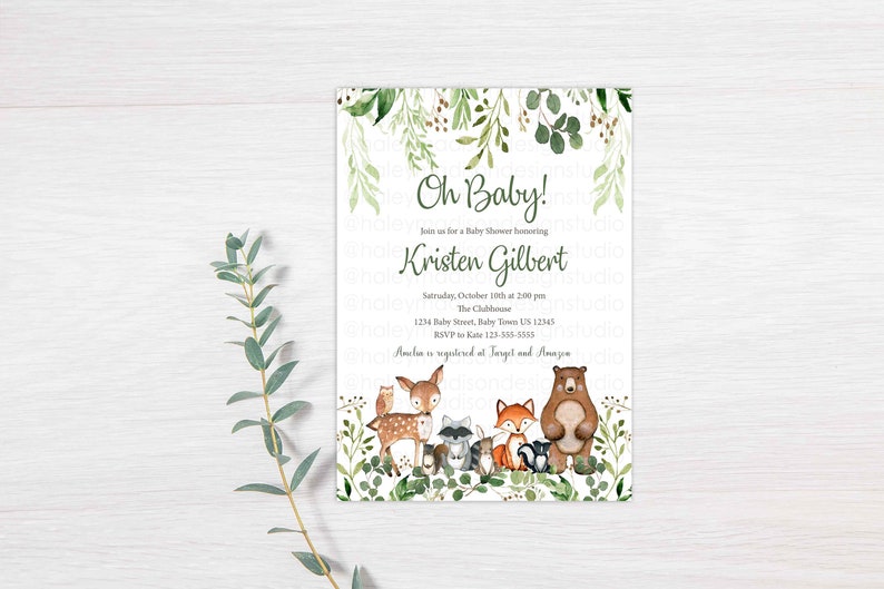 May include: A green and white baby shower invitation with a woodland theme. The invitation features a deer, fox, raccoon, owl, and bear surrounded by greenery. The text reads "Oh Baby!" and "Join us for a Baby Shower honoring Kristen Gilbert".