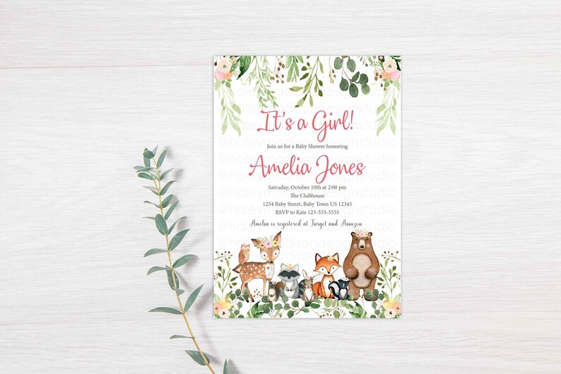 May include: It's a Girl! Baby shower invitation with a watercolor illustration of woodland animals, including a deer, fox, raccoon, and bear. The invitation includes the text "It's a Girl!" and "Amelia Jones".