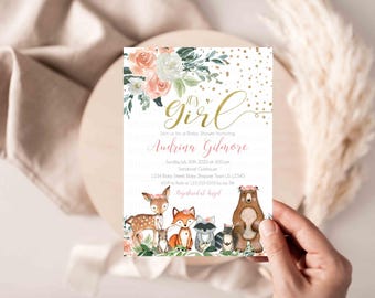 May include: It's a Girl baby shower invitation with a floral design and woodland animals. The invitation is gold and pink with white polka dots. The text reads "It's a Girl" and "Join us for a Baby Shower Honoring Audrina Gilmore".