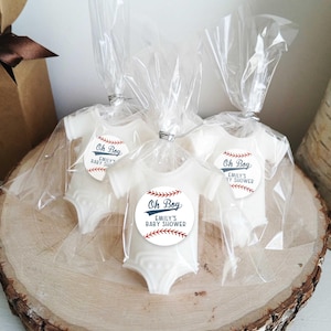 May include: Three white baby onesies with a baseball-themed design and the text "Oh Boy" and "Emily's Baby Shower".