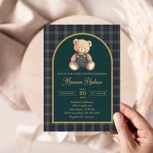 May include: A baby shower invitation featuring a teddy bear illustration. The invitation has a green and navy plaid background with gold accents. The text reads "Join us for a baby shower honoring Maureen Hudson" and includes date, time, and location details.
