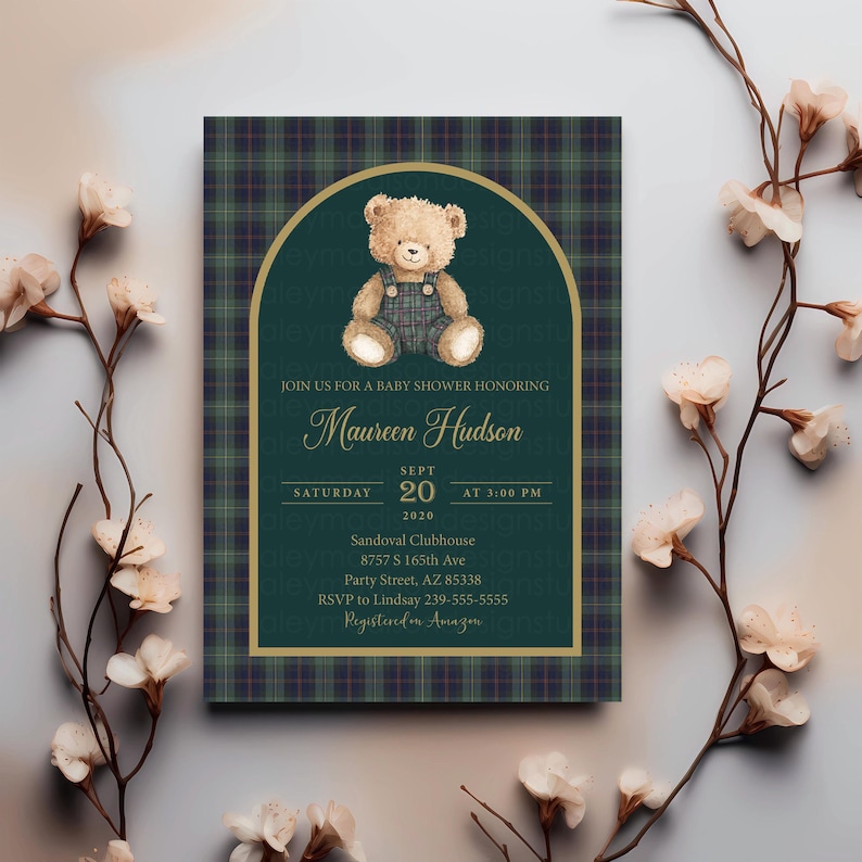 May include: Baby shower invitation with a teddy bear illustration. The invitation features a green and navy plaid background with gold accents. The text reads "Join us for a baby shower honoring Maureen Hudson" and includes the date, time, and location.