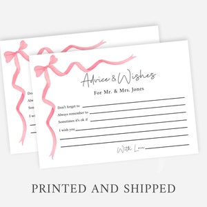 May include: Two white cards with pink ribbon designs and black lines. The text on the card reads "Advice & Wishes" for Mr. & Mrs. Jones. The card has lines for writing advice and wishes. The text "With Love" is at the bottom of the card.