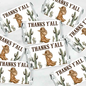 May include: A set of 10 favor tags with a western theme. The tags feature a brown cowboy boot with a brown cowboy hat on top, a green cactus, and the text "Thanks Y'all".