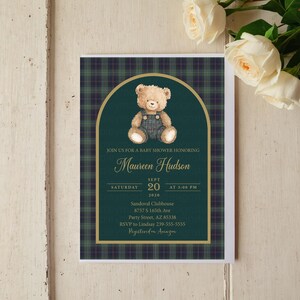 May include: Baby shower invitation with a teddy bear illustration. The invitation features a green and navy plaid background with gold accents. Text includes the name "Maureen Hudson", date, time, and location details.