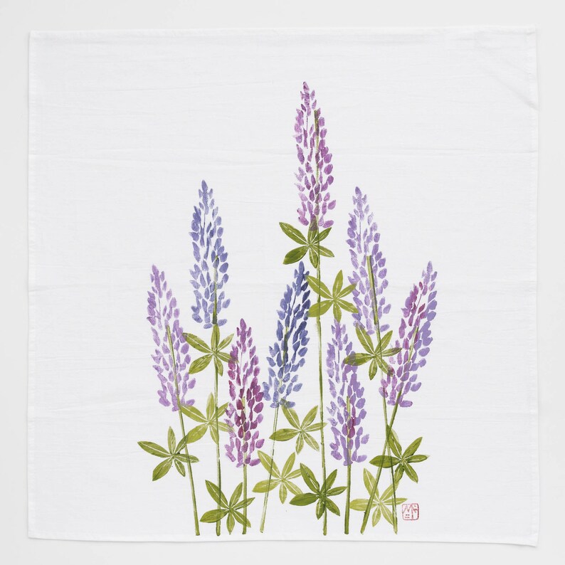 May include: A watercolor painting of a bouquet of purple and blue lupine flowers with green leaves on a white background.
