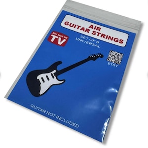 May include: A blue plastic bag with the words "AIR GUITAR STRINGS" and a black guitar graphic. The bag also has the text "NOT SEEN ON TV", "SET OF 6 UNIVERSAL", and "GUITAR NOT INCLUDED". A QR code and the word "ETSY" are also visible.