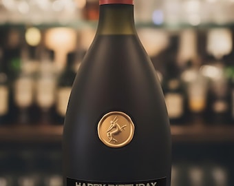 May include: A dark brown Remy Martin VSOP cognac bottle with a gold seal and black label that reads "Happy Birthday William". The bottle is labeled "Product of France" and is 40% ABV.