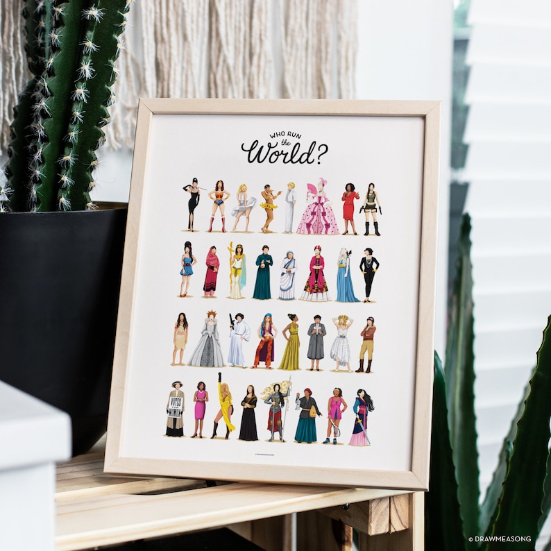 May include: A framed print with the text "Who Run the World?" and a colorful illustration of 30 women in various poses and outfits.
