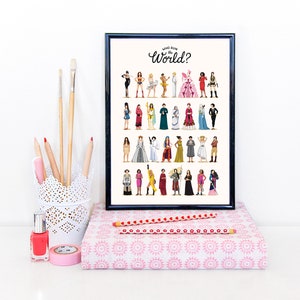 May include: A black framed print with a white background featuring a colorful illustration of women from different cultures and backgrounds. The text "Who Run the World?" is written in black cursive at the top of the print.