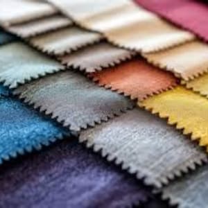 May include: A collection of fabric swatches in various colors and textures, including beige, blue, gray, yellow, and red.