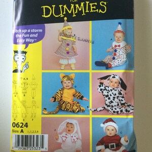 May include: A sewing pattern booklet for toddler costumes. The cover features a yellow background with the title "Sewing Patterns for Dummies" and images of children dressed in various costumes, including a clown, a tiger, a dalmatian, a bunny, and a Santa Claus.