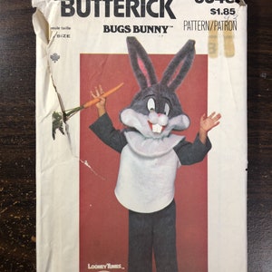 May include: A vintage sewing pattern for a Bugs Bunny costume. The pattern is from the Quick & Easy Butterick line and is numbered 6348. The pattern features a cartoon image of Bugs Bunny holding a carrot. The pattern is licensed by Warner Bros. and is dated 1974-1978.
