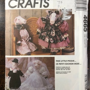 May include: McCall's Crafts pattern envelope featuring pig dolls. The envelope shows pig dolls in various outfits, including a bride and groom, and a pig in a dress. The text on the envelope reads "This Little Piggie..." and "Stuffed 18 inch dolls."