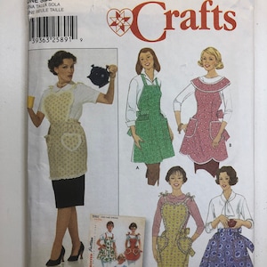 May include: A sewing pattern for making four different styles of aprons. The pattern is called Simplicity Crafts and the pattern number is 5961. The pattern includes instructions for making a heart-shaped apron, a ruffled apron, a gathered apron, and a simple apron.