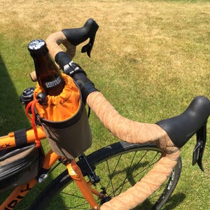 BAR BUCKET , handlebar mounted carrier for your water bottle or beverage made from used bike inner tubes